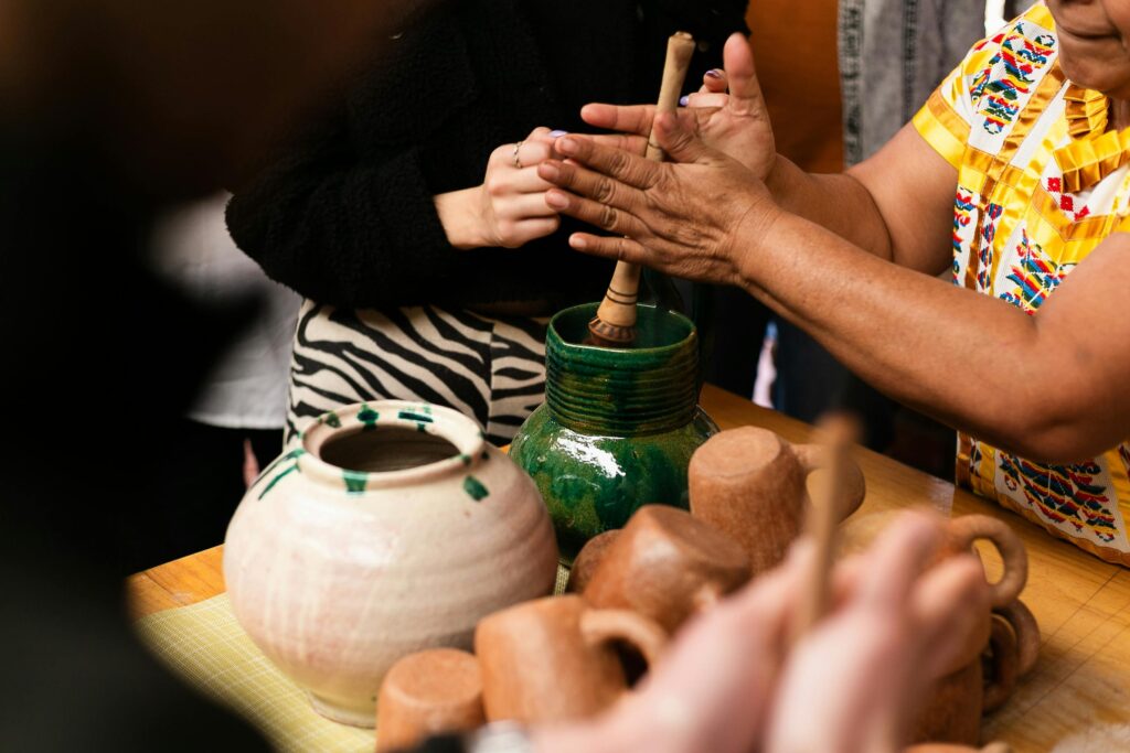 Woman painting a pot 