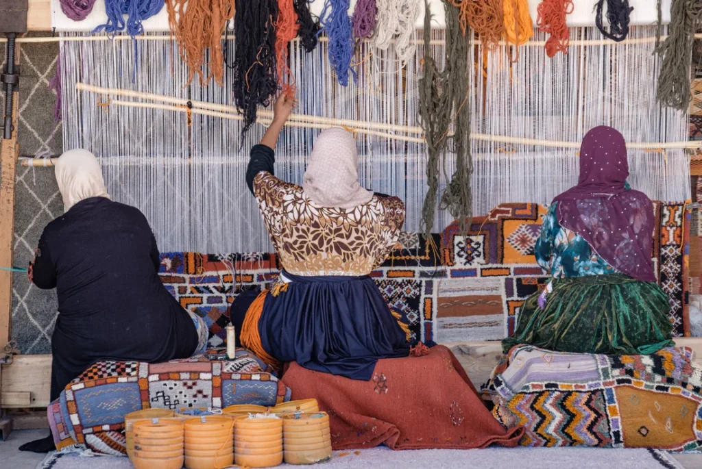 women crafting rugs